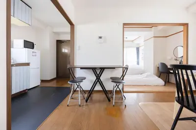 a kitchen and dining room with a table and chairs at Tokyo Kitasen 4 in Tokyo