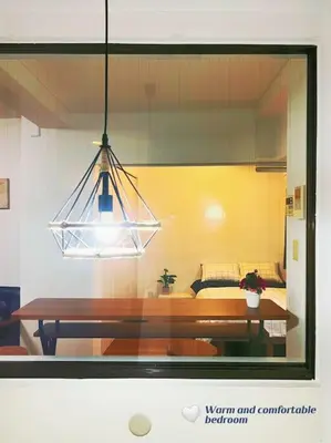 a reflection of a bedroom with a table in a window at Easily to Nishi-Nippori Shibuya Asakusa For 10 in Tokyo