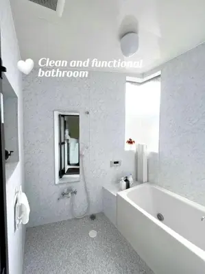 a white bathroom with a tub and a sink at Easily to Nishi-Nippori Shibuya Asakusa For 10 in Tokyo