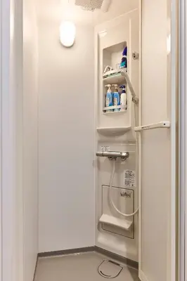 a refrigerator in a room with a door open at New\u6771\u4eac\u3067\u5bcc\u58eb\u5c71\u304c\u898b\u3048\u308bPentohouse ZEN \u5965\u6ca2\u99c51\u5206\u81ea\u7531\u30f6\u4e18\u5f92\u6b696\u5206\u6e0b\u8c37\u96fb\u8eca15\u5206 in Tokyo
