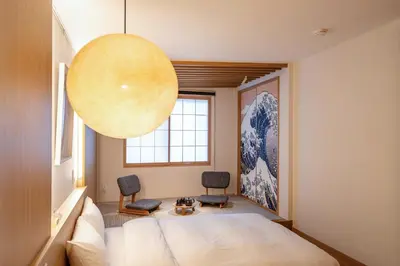 a bedroom with a bed and a large orb at Tokyo Modern Stay Shinjuku in Tokyo