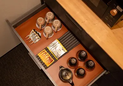 an overhead view of a table with plates and utensils at Tokyo Modern Stay Shinjuku in Tokyo