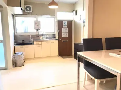 a kitchen with a table and chairs in a room at Okubo Daiichi House 1B OD1B in Tokyo
