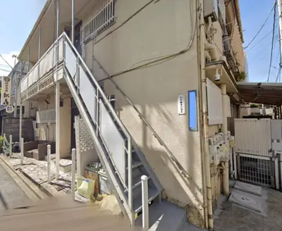 a stairway leading up to a building with a building at Okubo Daiichi House 1B OD1B in Tokyo