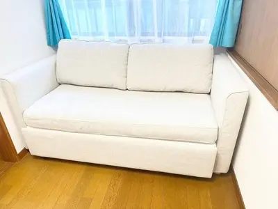 a white couch in a room with a window at Walk to World Athletics! Prime Omotesando 2min sta in Tokyo