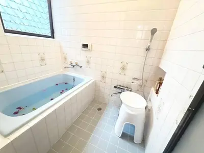 a bathroom with a tub and a toilet and a sink at Walk to World Athletics! Prime Omotesando 2min sta in Tokyo