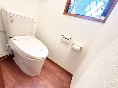 a white toilet in a bathroom with a window at Walk to World Athletics! Prime Omotesando 2min sta in Tokyo