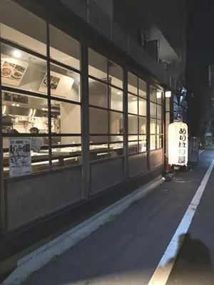 a store window at night with a sign in it at \u30b0\u30ea\u30fc\u30f3\u30cf\u30a6\u30b9 in Tokyo