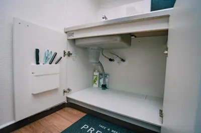 a bathroom with a sink and a rug at Natsumi 2 \u30db\u30c6\u30eb in Tokyo