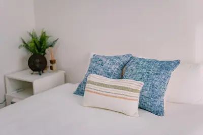 two pillows sitting on top of a bed at Natsumi 2 \u30db\u30c6\u30eb in Tokyo