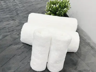 a white bench sitting next to a plant at Ikebukuro Area 1F03 NishiikeApartment in Tokyo