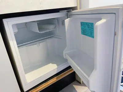 an empty refrigerator with its door open in a kitchen at JR\u6da9\u8c37\u7ad9\u6b65\u884c8\u5206\u6700\u8fd1\u8f66\u7ad9\u6b65\u884c4\u5206\u514d\u8d39WiFi\u76f4\u8fbe\u4e1c\u4eac\u539f\u5bbf\u4e0a\u91ce in Tokyo