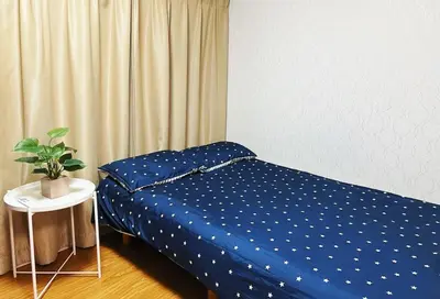 a bedroom with a blue bed with a plant on it at Easily to Ikebukuro Asakusa Shibuya for 5 in Tokyo
