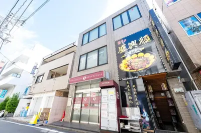a building with a sign on the side of a street at Hotel Grand Fort - Vacation STAY 85455v in Tokyo