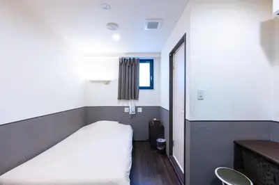 a small room with a bed and a window at Hotel Grand Fort - Vacation STAY 85406v in Tokyo