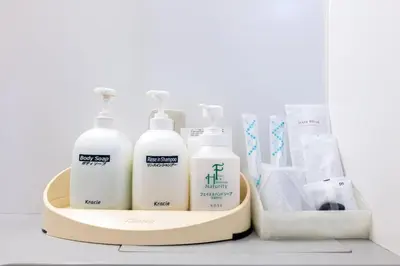 a tray with four bottles of soap and other hygiene products at Hotel Grand Fort - Vacation STAY 85406v in Tokyo