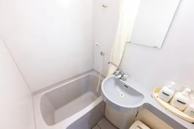 a white bathroom with a sink and a bath tub at Hotel Grand Fort - Vacation STAY 85501v in Tokyo