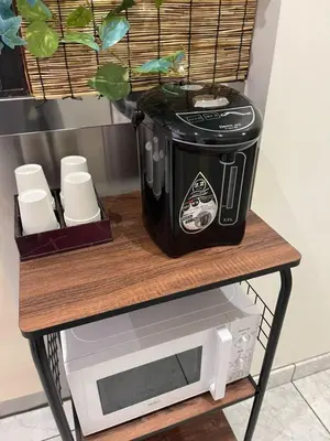 a toaster sitting on a table next to a microwave at Hotel Grand Fort - Vacation STAY 85501v in Tokyo
