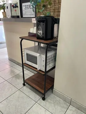a table with a microwave on top of a counter at Hotel Grand Fort - Vacation STAY 85501v in Tokyo