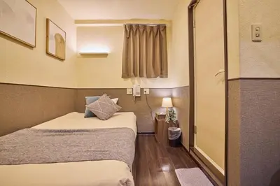 a small room with two beds and a window at Hotel Grand Fort - Vacation STAY 85443v in Tokyo