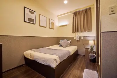a small bedroom with a bed in a room at Hotel Grand Fort - Vacation STAY 85443v in Tokyo
