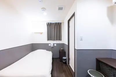 a hospital room with a bed and a mirror at Hotel Grand Fort - Vacation STAY 85443v in Tokyo