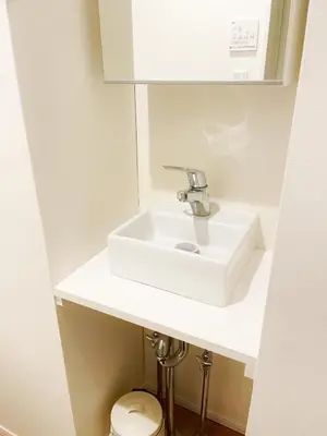 a bathroom with a white sink and a toilet at Chill Fortuna Shimokitazawa Tokyo in Tokyo