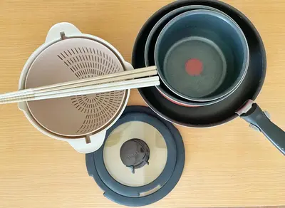a pot and a strainer with chopsticks in it at Chill Fortuna Shimokitazawa Tokyo in Tokyo