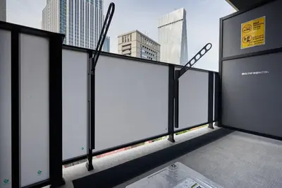 a balcony with a view of a city at \u30a2\u30eb\u30c8\u30f4\u30a3\u30e9\u864e\u30ce\u9580 in Tokyo