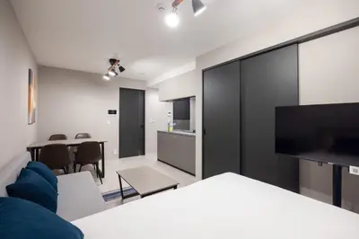 a room with a living room and a dining room at PREAs\u4e2d\u91ce\u65b0\u4e95 in Tokyo