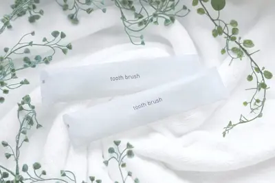 two white towels on a white table with plants at PREAs\u4e2d\u91ce\u65b0\u4e95 in Tokyo