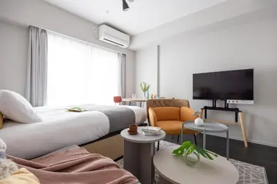 a hotel room with a bed and a tv at PREAs\u4e2d\u91ce\u65b0\u4e95 in Tokyo