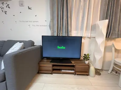 a tv sitting on a table in a living room at Spacious Cozy house in Shinjuku Free parking wifi in Tokyo