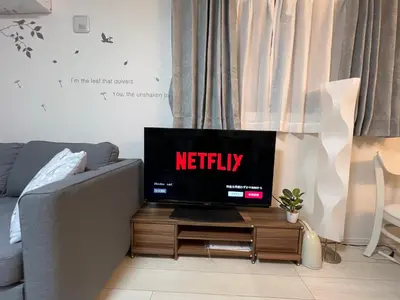 a tv sitting on a table in a living room at Spacious Cozy house in Shinjuku Free parking wifi in Tokyo