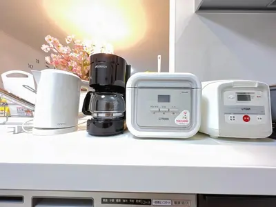 a kitchen counter with a coffee maker and other appliances at Spacious Cozy house in Shinjuku Free parking wifi in Tokyo