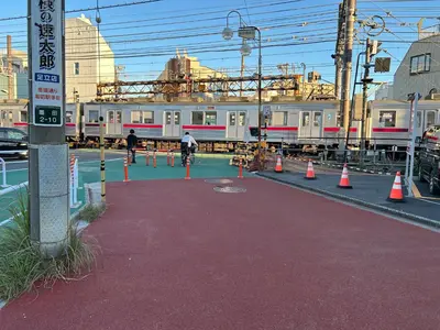 a train on a track with cones around it at \u9759\u8c27\u65f6\u5149 in Tokyo