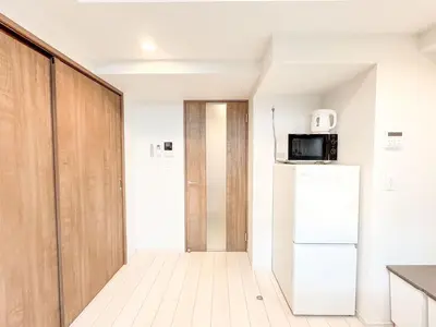 a kitchen with a refrigerator and a microwave at Triphome Tokyo Sugamo 2024 New 3 mins 2 stations in Tokyo