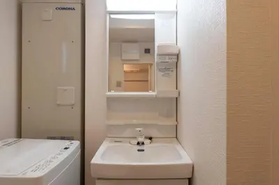 a bathroom with a sink and a mirror at Jeunesse\u7acb\u82b1 in Tokyo