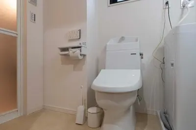 a bathroom with a white toilet in a room at Jeunesse\u7acb\u82b1 in Tokyo