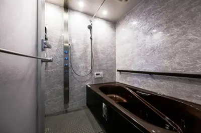 a bathroom with a shower and a sink and a tub at Origami-ya Stay Zen - Luxury Asakusa Penthouse in Tokyo