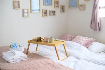 a table on top of a bed with a table on it at Origami-ya Stay Zen - Luxury Asakusa Penthouse in Tokyo