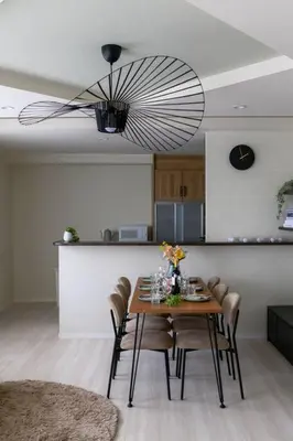 a dining room table with chairs and a chandelier at Origami-ya Stay Zen - Luxury Asakusa Penthouse in Tokyo