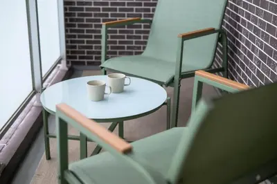 two coffee cups sitting on a table on a balcony at Origami-ya Stay Zen - Luxury Asakusa Penthouse in Tokyo