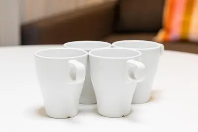 four white cups sitting on top of a table at A 3rooms MAX8people 6min Shinjuku 11min Shibuya 12min walk Ikebukuro LEON RESORT IKEBUKURO traditional Japanese room \u6c60\u888b \u6700\u59278\u540d in Tokyo