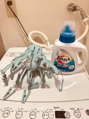 a couple of robots sitting on top of a sink at Shirokane Apartment Hotel 3 in Tokyo
