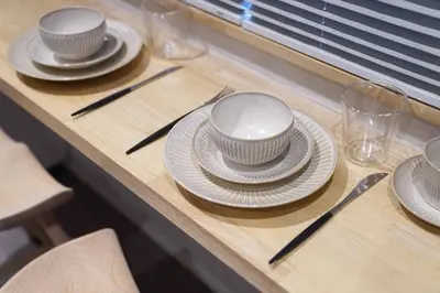 a table with plates and cutlery on it at Real Life IIDABASHI in Tokyo