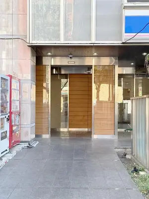 an entrance to a building with wooden doors at The Plars in Tokyo