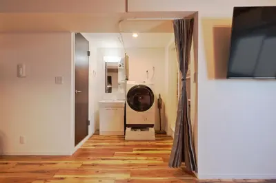 a bathroom with a washing machine in a room at V Close to Shinjuku Kabukicho Korean Town FrWIFI K in Tokyo