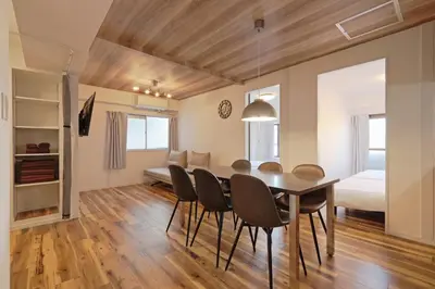 a dining room with a table and chairs and a bedroom at V Close to Shinjuku Kabukicho Korean Town FrWIFI K in Tokyo