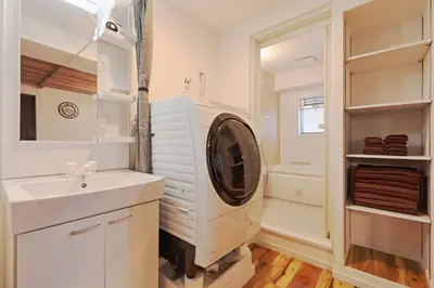 a white laundry room with a washing machine in it at V Close to Shinjuku Kabukicho Korean Town FrWIFI K in Tokyo